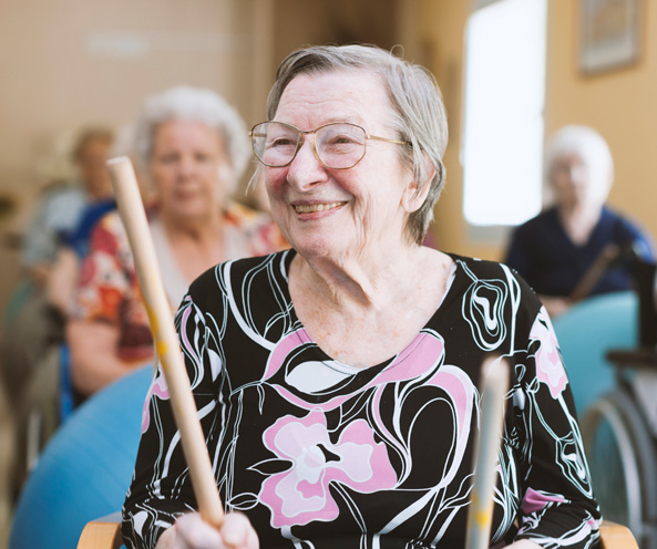 Elderly woman with drumsticks